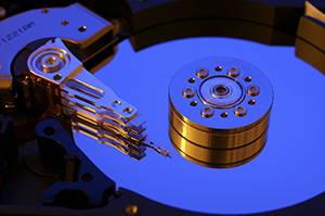 The interface between a slow non-volatile memory, like the hard drive in this picture, and fast electronic memory is a key bottleneck to computer performance