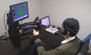 A user operating the brain–computer interface stroke rehabilitation system.
