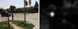 Saliency map (right) of an image (left), which illustrates how a computer model is able to identify salient information such as the high visibility vest from an image based on statistical analysis.
