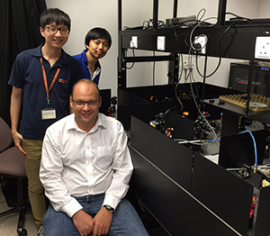 From front to back: Leonid Krivitsky, Dai Jibo and Len Yink Loong from the A*STAR Data Storage Institute.