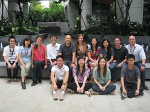 Photo of group with Shanshan Howland second from the left in the back row, Laurent Rénia fifth from the left in the back row and Chek Meng bottom right.